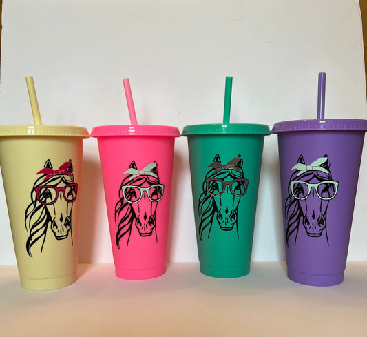 Four cups with bright and lively horse patterns are displayed in the image. 
